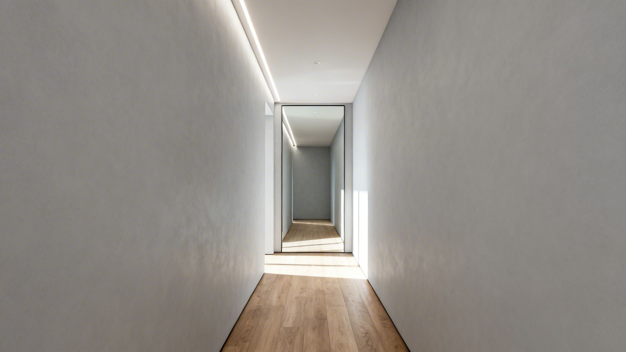 Pasillo moderno y minimalista con paredes grises, suelo de madera, iluminación LED y espejo al fondo.